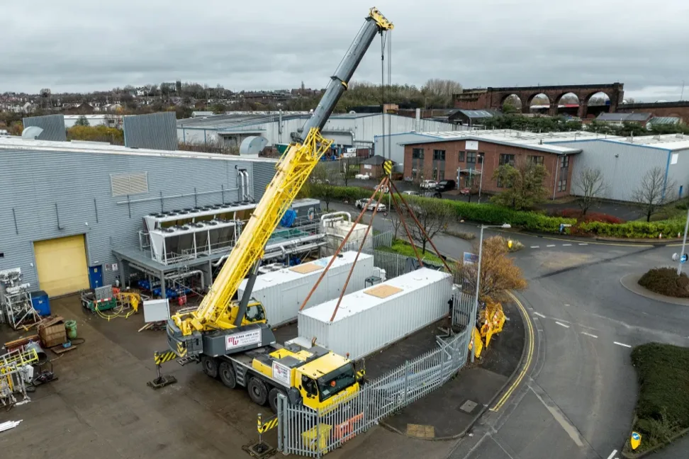 Boulton containerised power station arriving by crane: a complete CHP plant in a single enclosure
