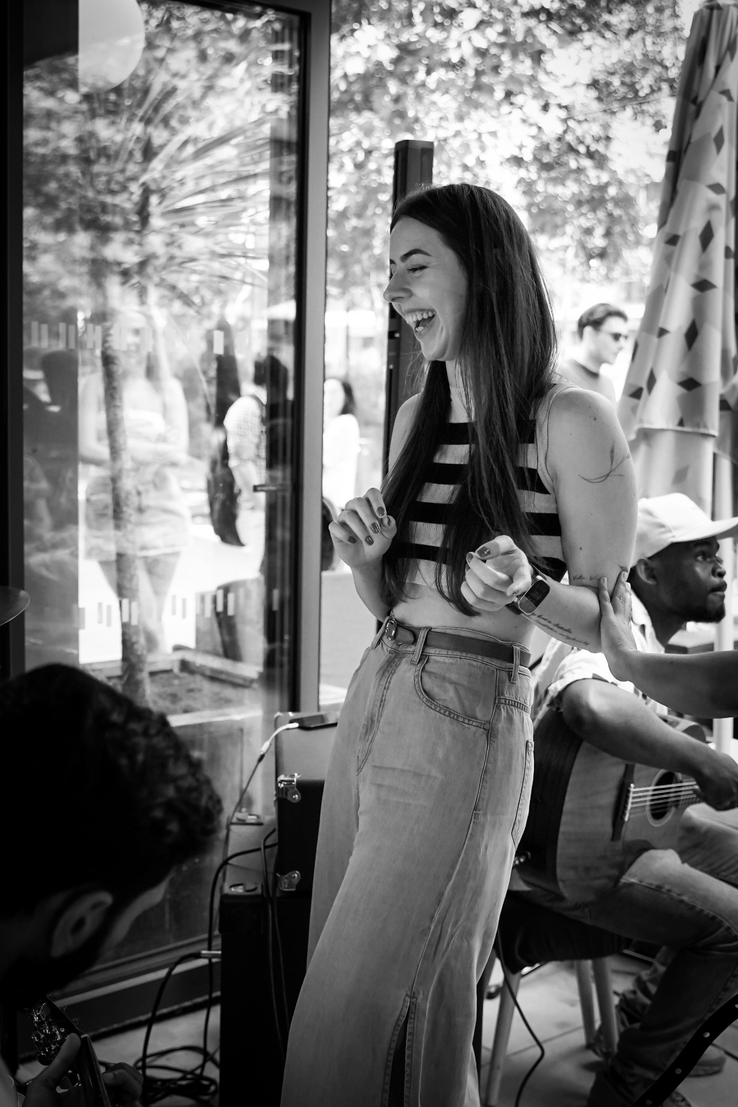 Angela smiling at an open mic