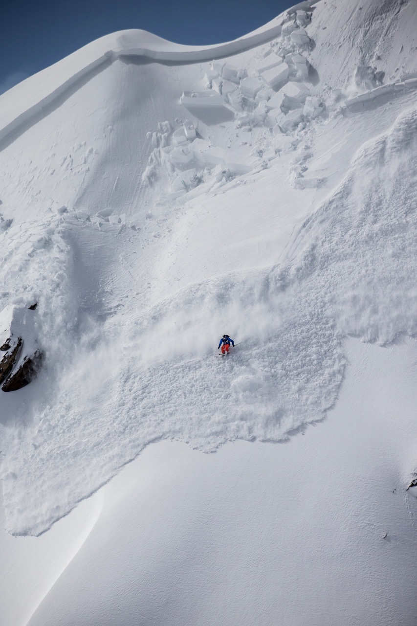 Rider descending a wide snow face